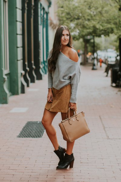gray strapless sweater with a light brown mini skirt