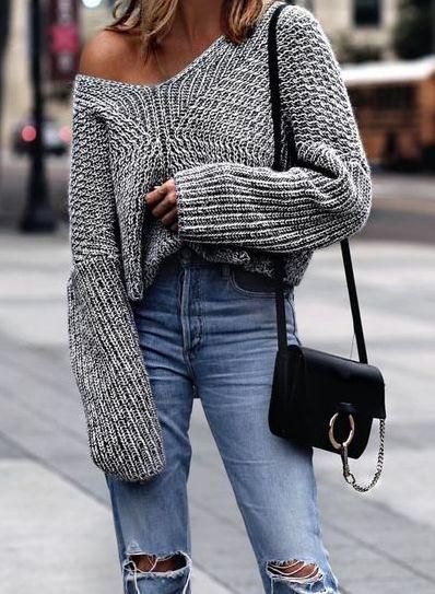 gray oversized knitted one shoulder sweater and ripped boyfriend jeans