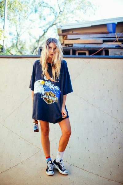 gray oversized graphic t-shirt with team socks and low sneakers