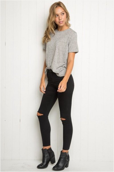 gray, partially hidden, oversized T-shirt with black, pulled up skinny jeans
