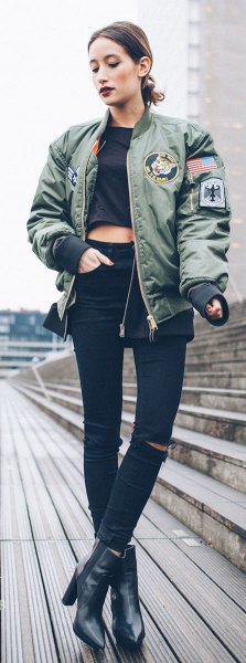 gray patch pilot jacket with black, cropped T-shirt and leather boots