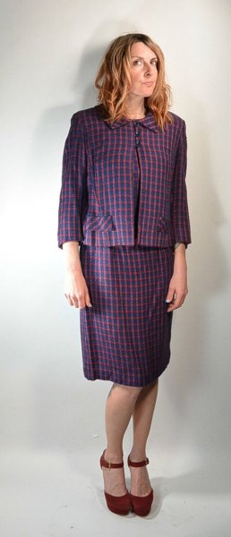 gray checked blazer with a matching knee-length skirt with a straight cut
