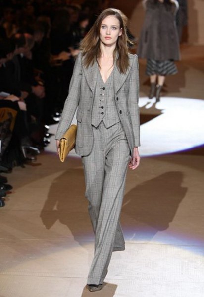 gray checked suit with wide-leg pants and brown leather handbag