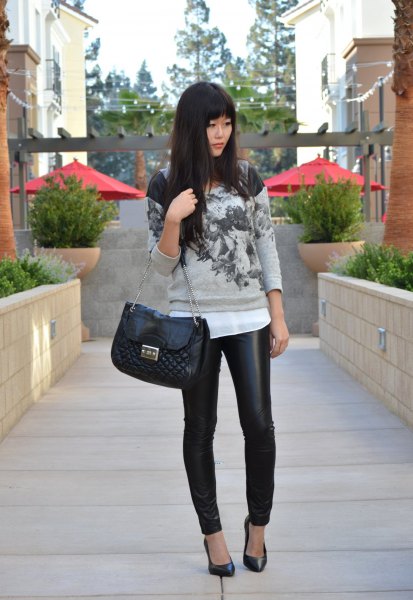 gray printed sweater with white chiffon blouse and quilted wallet made of black leather