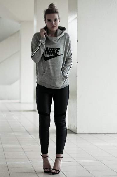 gray pullover hoodie with black skinny jeans and open toe heels