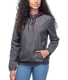 gray pullover windbreaker with blue slim fit jeans