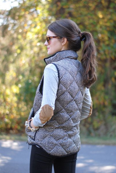 gray quilted long down vest with white top with patch elbows