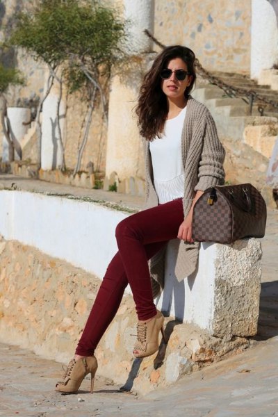 gray, ribbed longline cardigan with maroon jeans and boots with heel