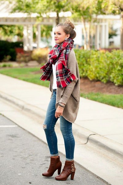 gray ribbed cardigan with a red plaid scarf and ankle-high boots
