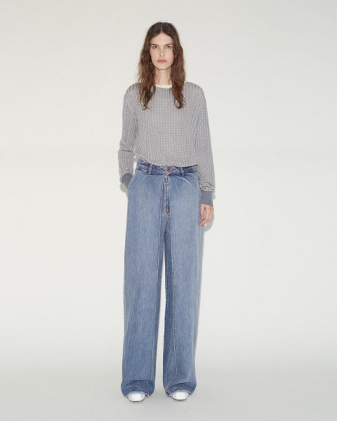 gray ribbed sweater with light blue pleated wide-leg jeans