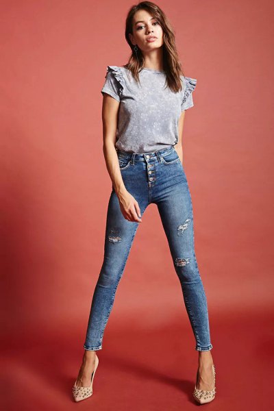 gray t-shirt with ruffle shoulder and blue skyscraper jeans
