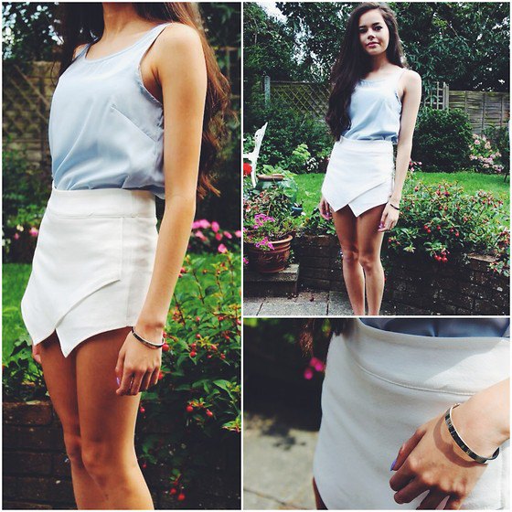 gray tank top with scoop neckline and white mini skirt