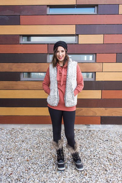 gray sherpa vest with red hoodie and leggings