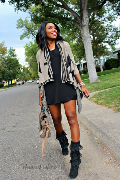 gray cardigan with black mini dress and autumn boots with fringes in the middle of the calf