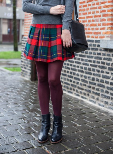 gray sweater with red flannel pleated mini skirt
