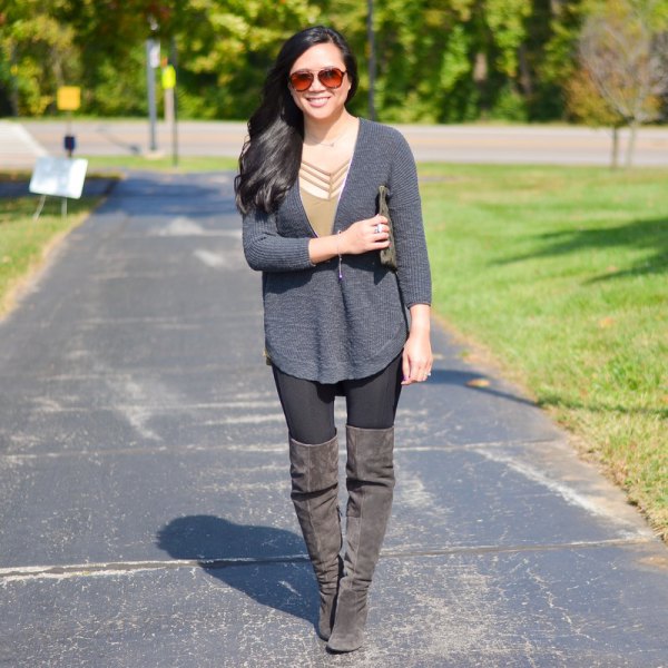 gray sweater with zipper boots made of suede
