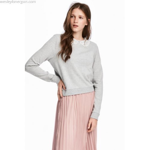 gray sweatshirt with light pink pleated midi skirt