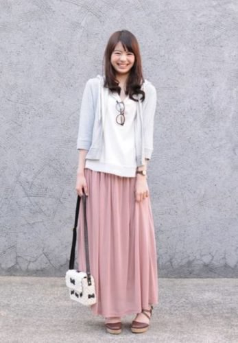 gray three-quarter-sleeved hooded jacket with hood and blushing pink maxi skirt