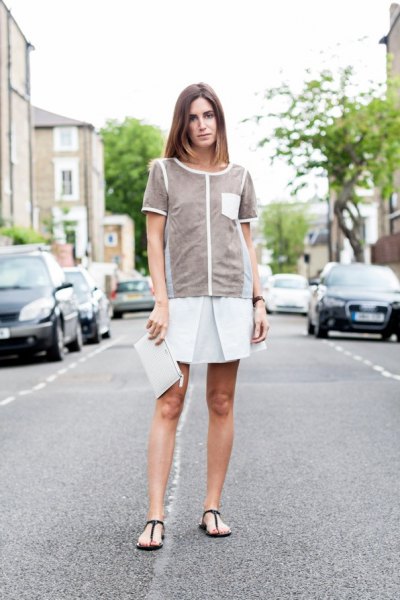gray top with white minirater skirt and black flip-flops