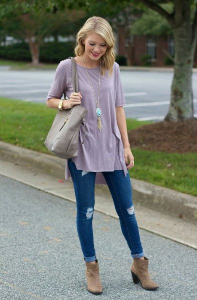 gray tunic t-shirt with blue ribbed skinny jeans with cuffs and brown suede boots