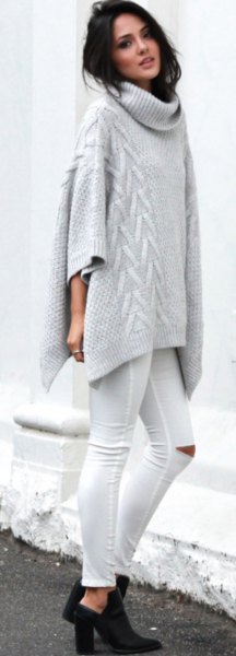 gray turtleneck poncho sweater with cables and white skinny jeans