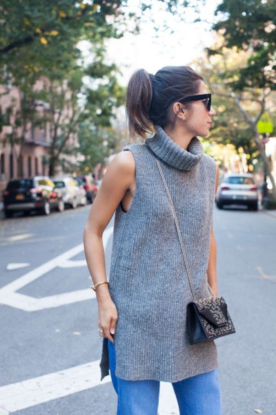 gray sleeveless rib tunic with turtleneck and blue straight leg jeans