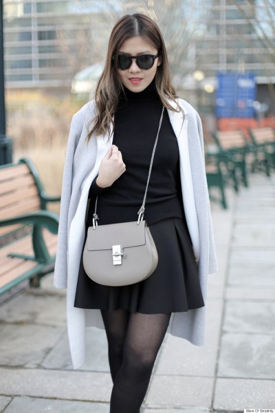 gray wool coat over the shoulder black skater skirt