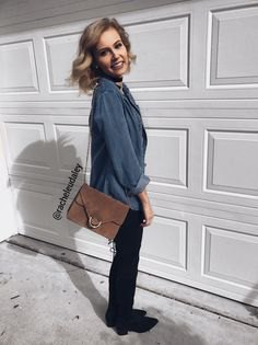 gray-blue shirt with buttons, black slim fit jeans and gray suede shoulder bag