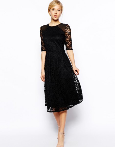 black dress with half sleeves and a flared lace dress