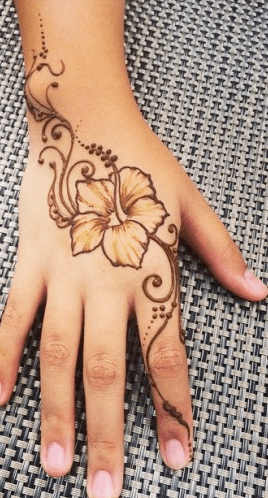 Hawaiian flower tattoo on hand
