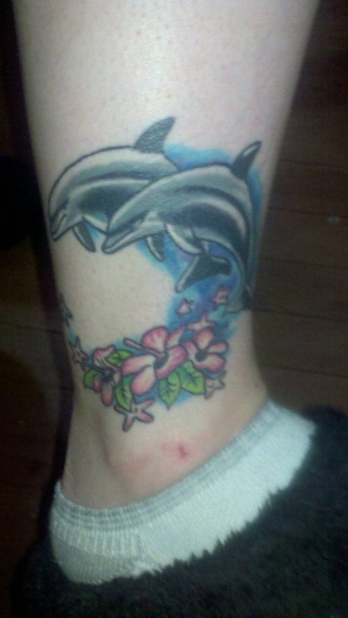 Hawaii flower with dolphin tattoo