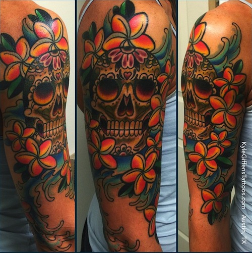 Hawaii flower with skull tattoo arm