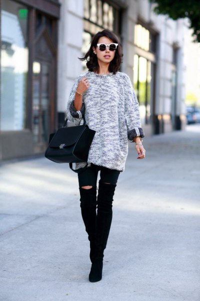 heather gray knitted sweater with black, ripped knee jeans