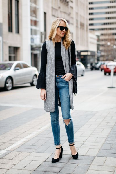 gray gray long vest with black bell-sleeved blouse