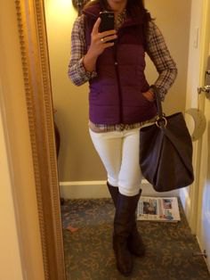 purple vest with hood and plaid shirt and white jeans