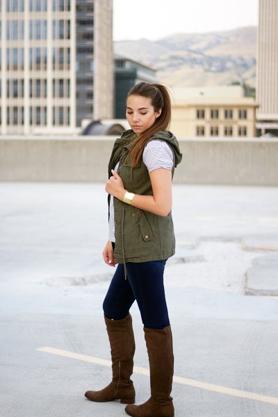 Hooded vest with gray t-shirt and knee-high boots