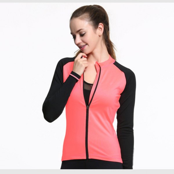 pink and black sports blazer with a semi-transparent tank top with a scoop neckline