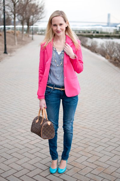 pink blazer with a blue polka dot blouse with a V-neckline and skinny jeans