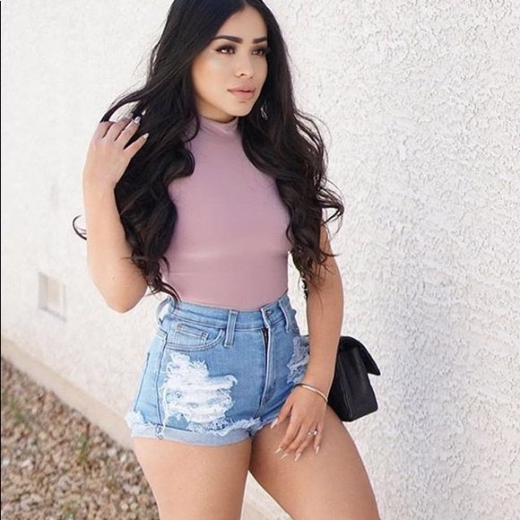 pink bodycon t-shirt with blue high-waisted shorts