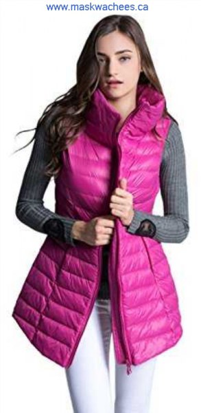 Pink-colored long down vest with gray, ribbed, figure-hugging sweater
