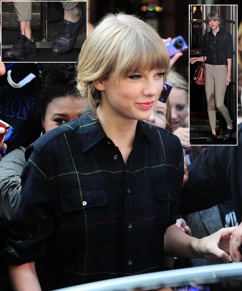 Taylor Swift's Dark green plaid shirt, tan pants and navy oxfords .