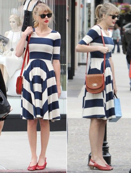 Navy and white striped skater dress with red kitten heel sandals .