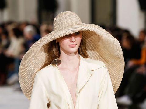 How the oversized straw hat became this summer's key accessory .
