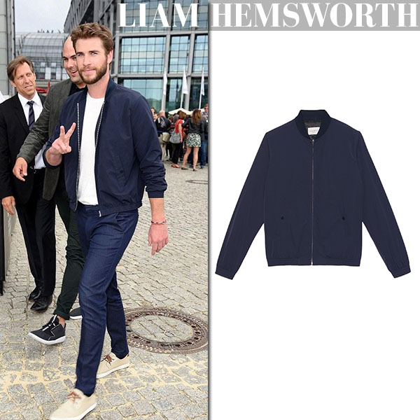 Liam Hemsworth in blue bomber jacket in Berl