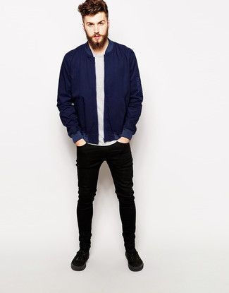 Wear a deep blue bomber jacket with black slim jeans to create a .