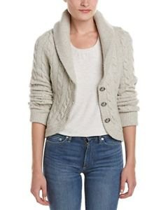 Ivory cable knit blazer with white scoop neck top and blue jeans