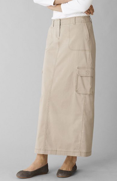 Ivory long khaki skirt with straight cut and white long-sleeved top