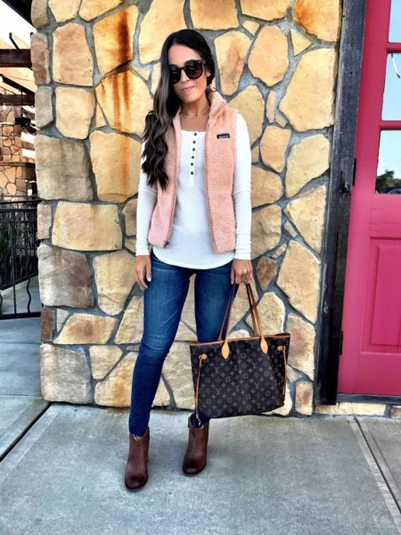 Ivory vest over white ankle boots