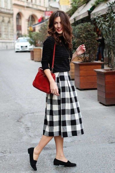 Knitted sweater with a black and white midi plaid wool skirt