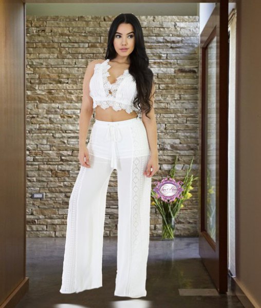 Lace bralette with white, semi-transparent beach pants with wide legs